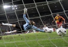 Fc Sion goalkeeper Germano Vailati (L) and Galatasaray's Umit Karan watch as the ball fired by Galatasaray's Tobias Linderoth (not pictured) enters the goal during their UEFA Europa League group stage, first leg match 20 September 2007 in Geneva Fc Sion goalkeeper Germano Vailati (L) and Galatasaray's Umit Karan watch as the ball fired by Galatasaray's Tobias Linderoth (not pictured) enters the goal during their UEFA Europa League group stage, first leg match 20 September 2007 in Geneva